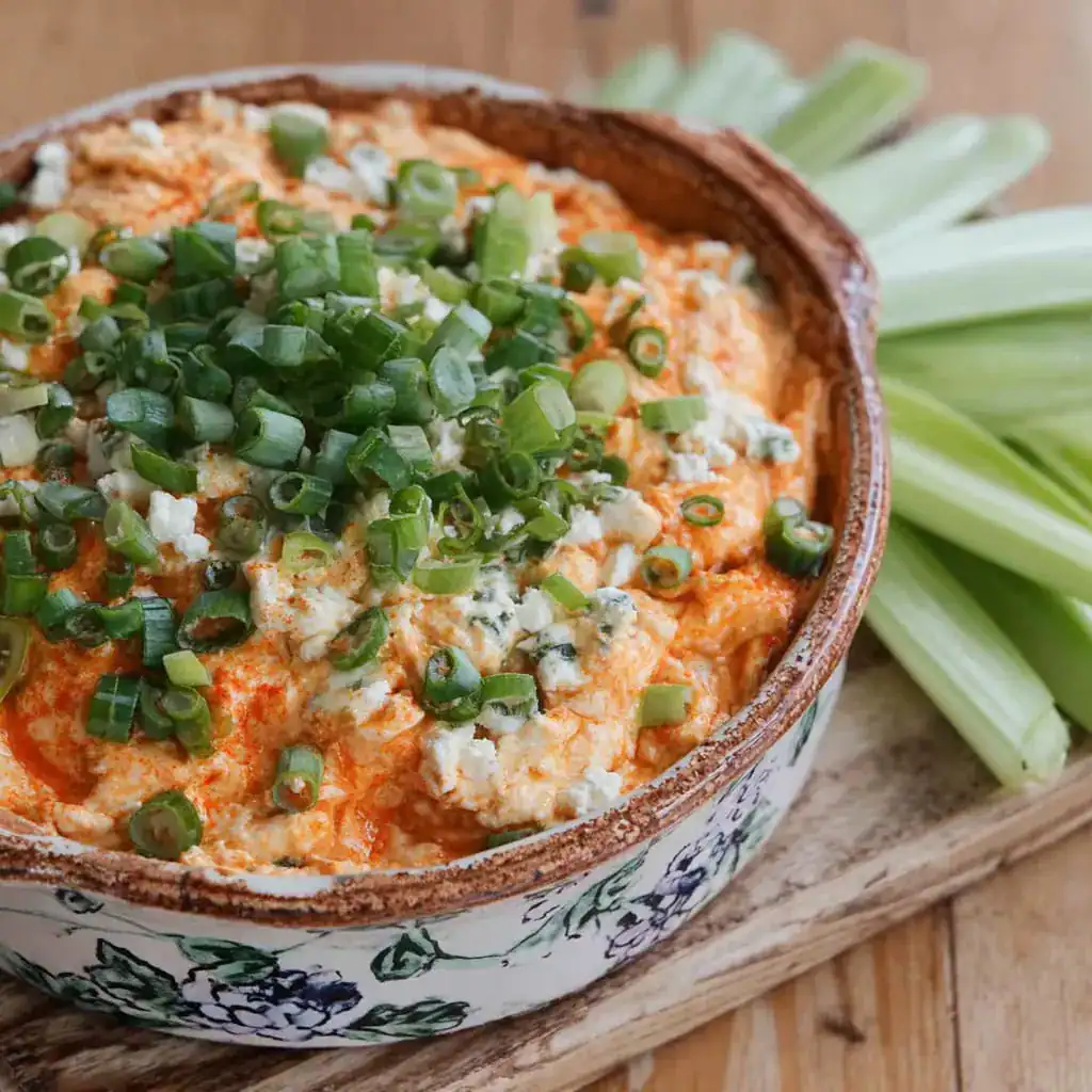 Cottage cheese buffalo chicken dip in rustic bowl
